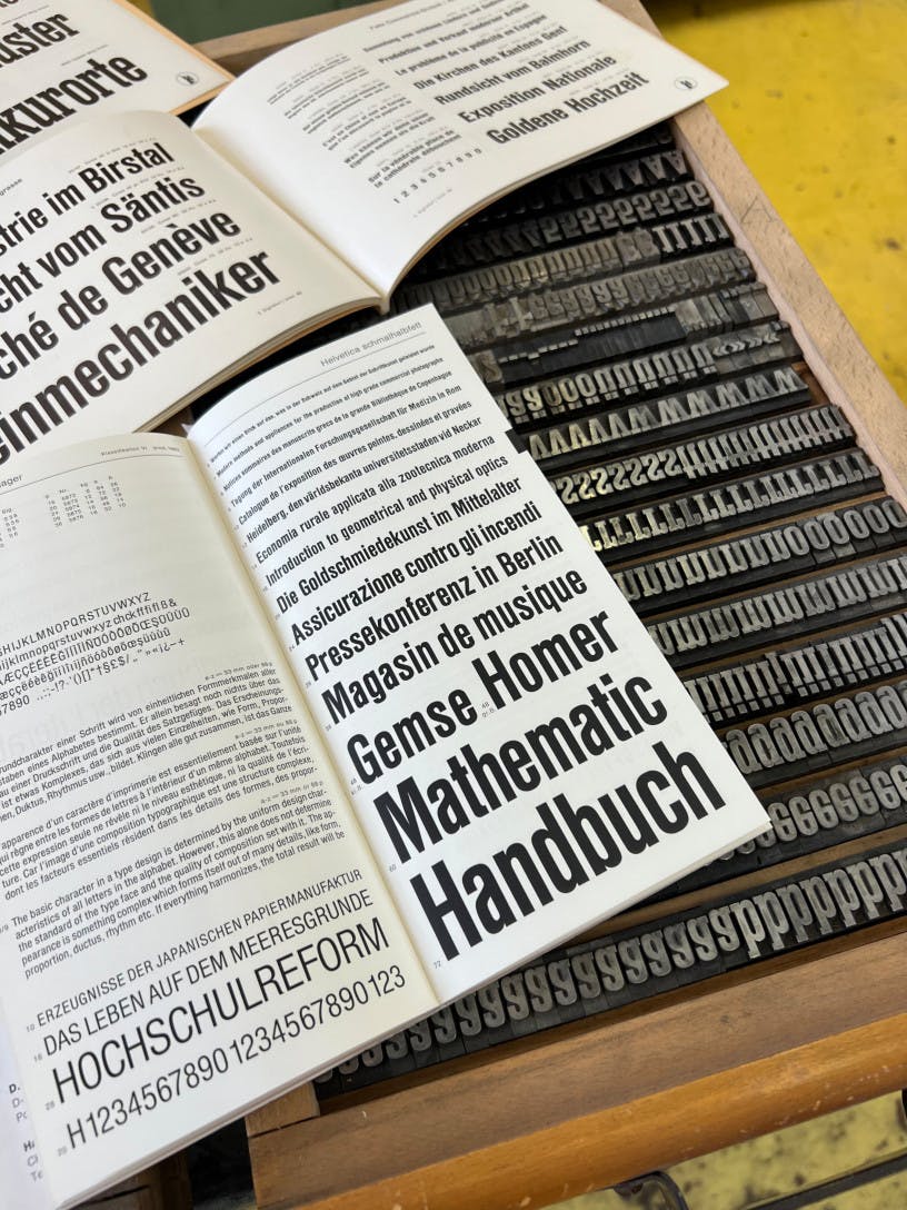Printed specimen sheet with Helvetica Schmalhalbfett on the physical case of Superba condensed.